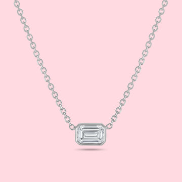 1 carat emerald cut diamond bezel